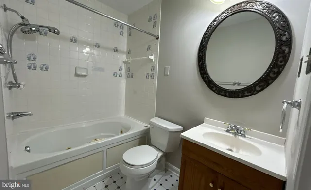 a view of a room with wooden floor and window
