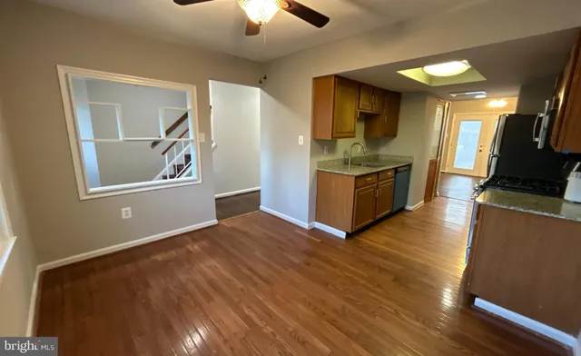 a view of a kitchen cabinets and wooden floor