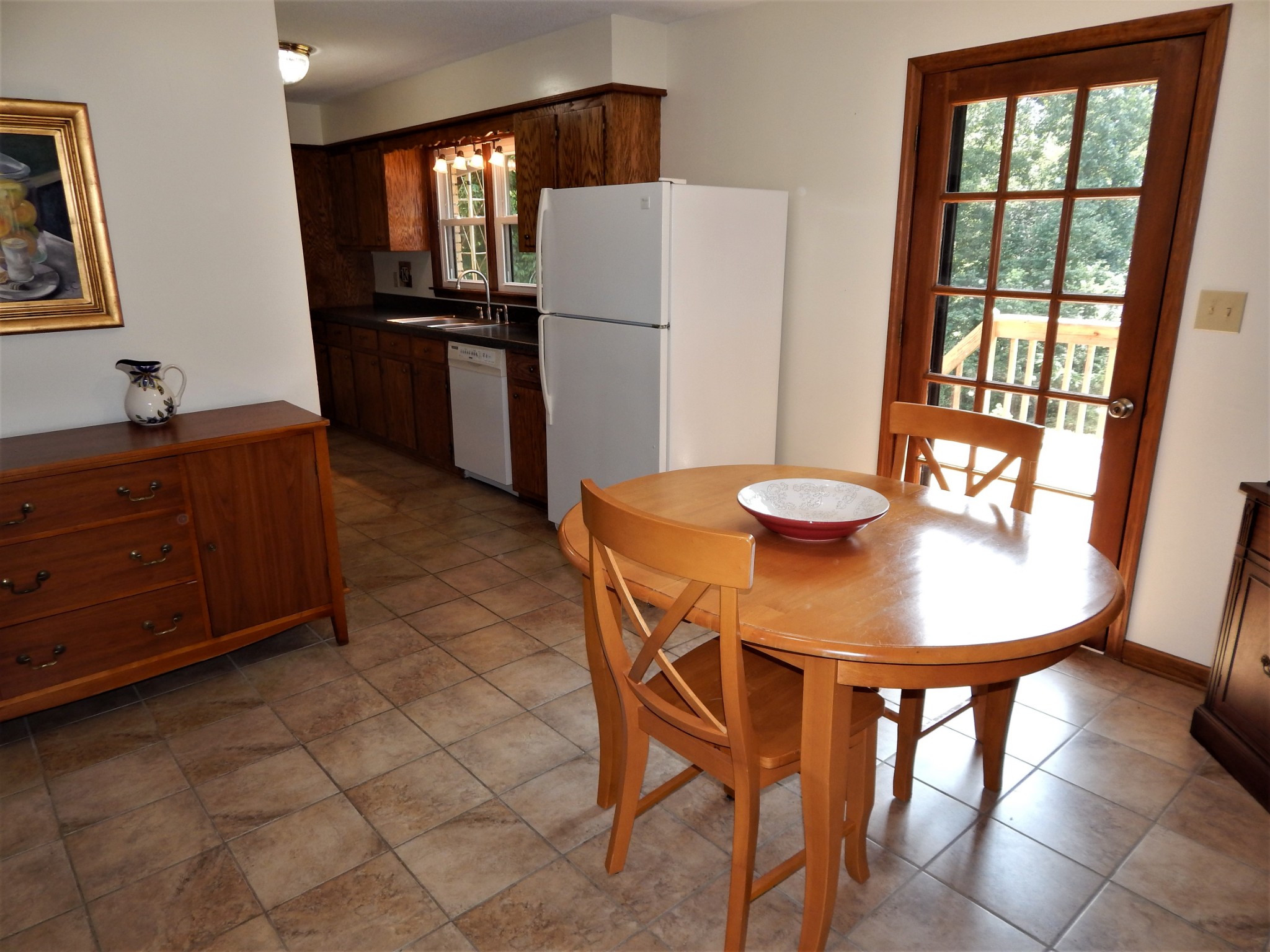 3753 Chisholm Road Iron City, TN 38463 - Photo 12 of 50 a kitchen with stainless steel appliances granite countertop a refrigerator a sink a stove and island