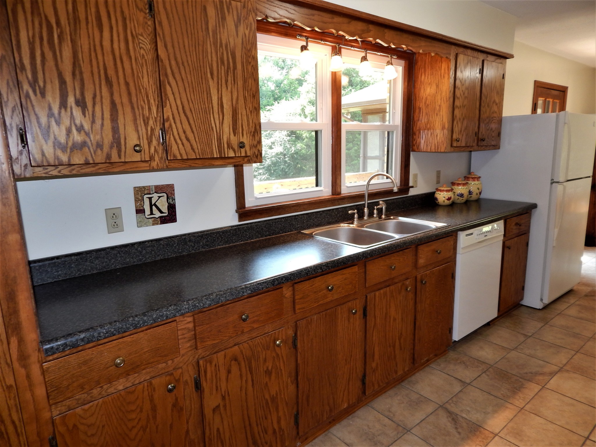 3753 Chisholm Road Iron City, TN 38463 - Photo 13 of 50 a kitchen with stainless steel appliances granite countertop a sink and a cabinets