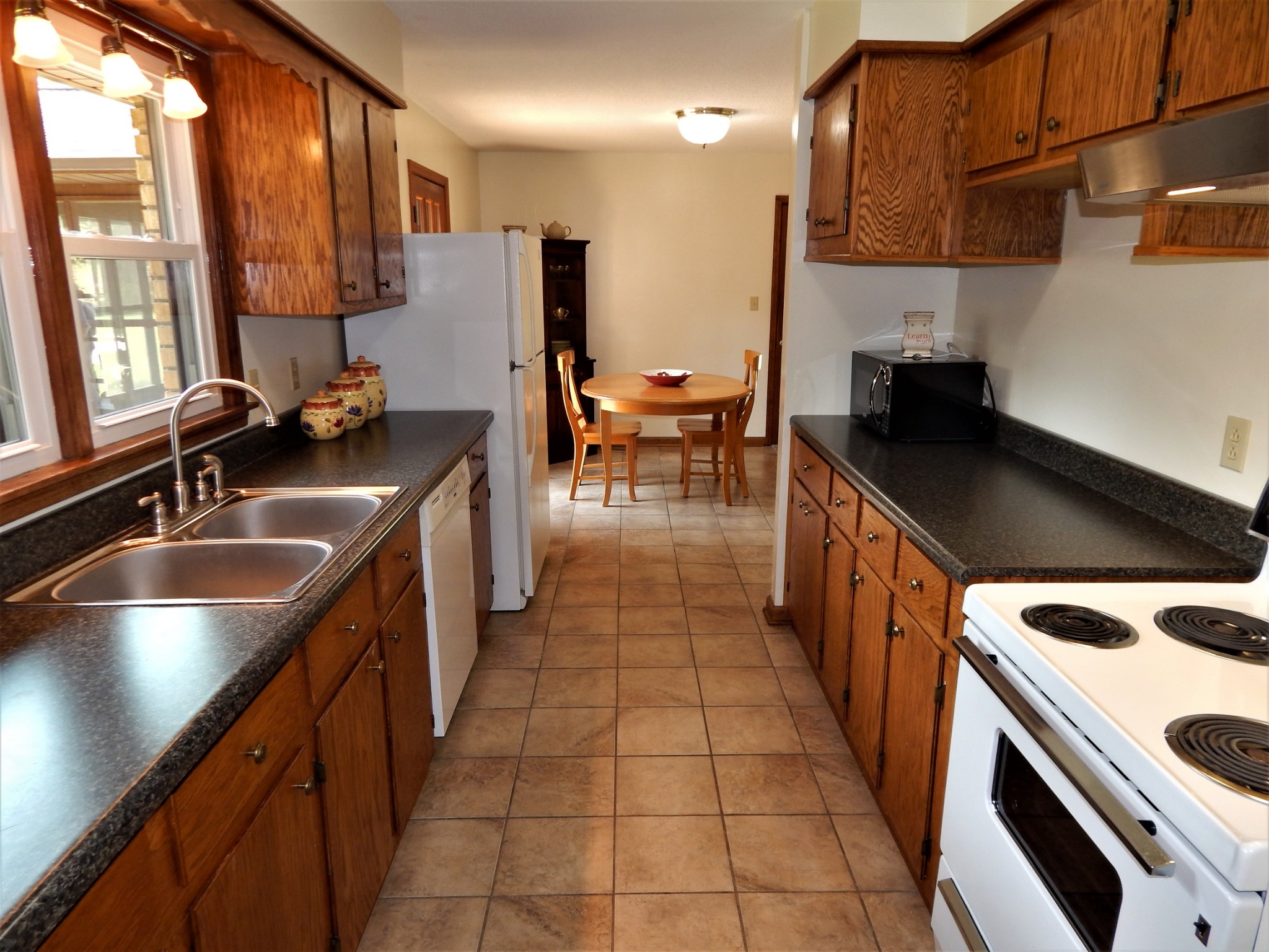 3753 Chisholm Road Iron City, TN 38463 - Photo 15 of 50 a kitchen with stainless steel appliances a sink stove and cabinets