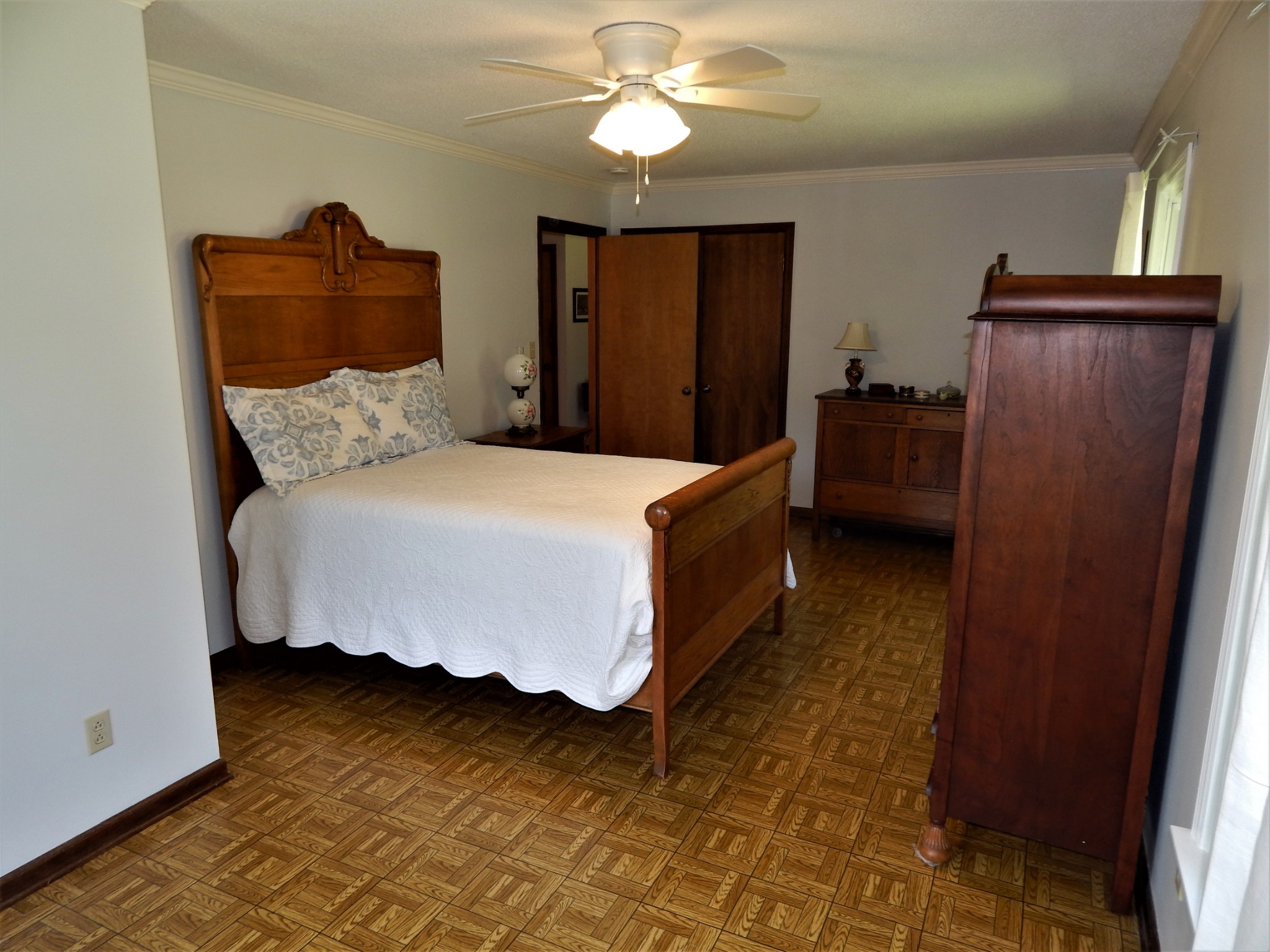 3753 Chisholm Road Iron City, TN 38463 - Photo 17 of 50 a bed room with a bed and a ceiling fan