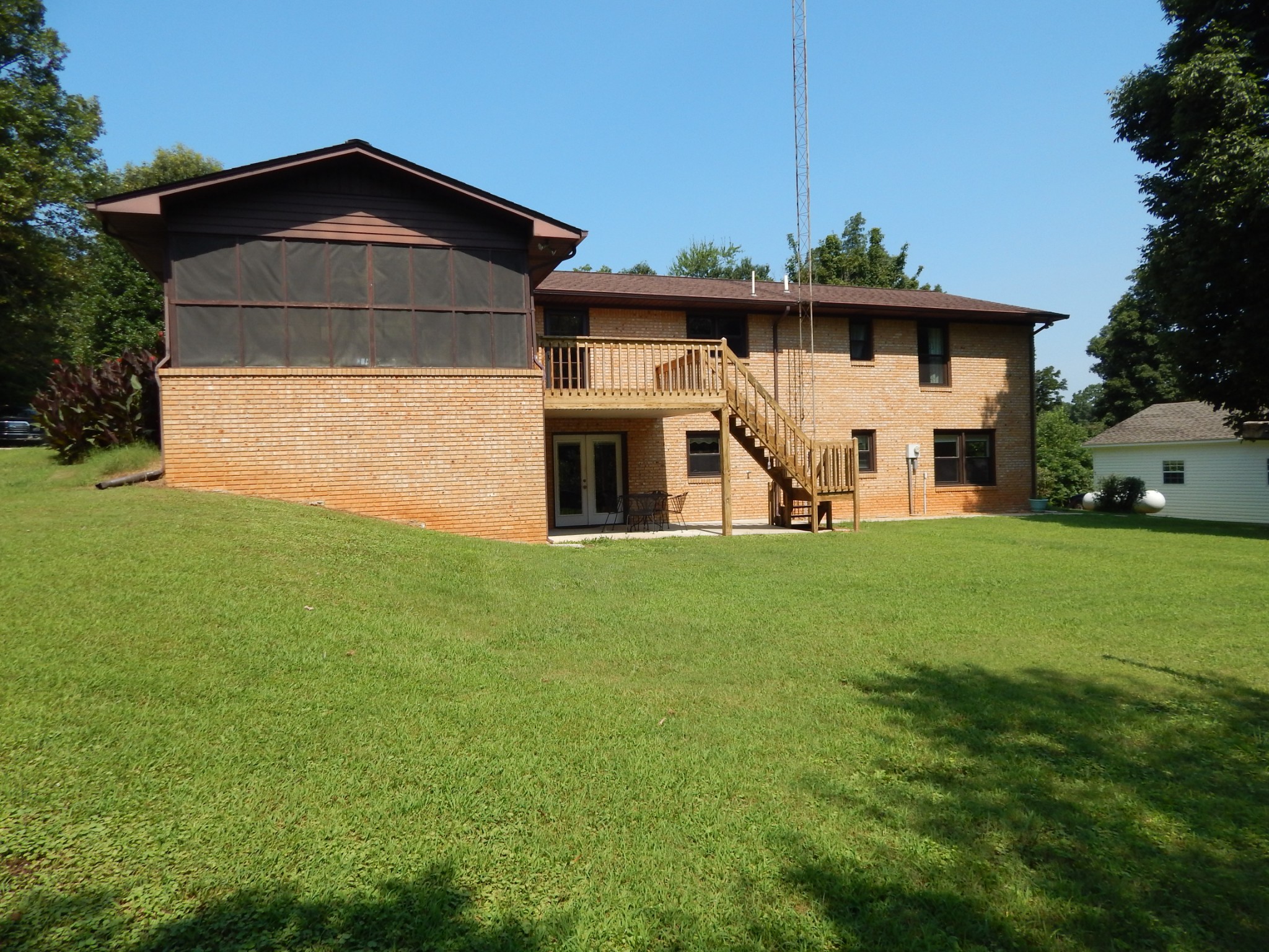 3753 Chisholm Road Iron City, TN 38463 - Photo 3 of 50 a front view of a house with garden