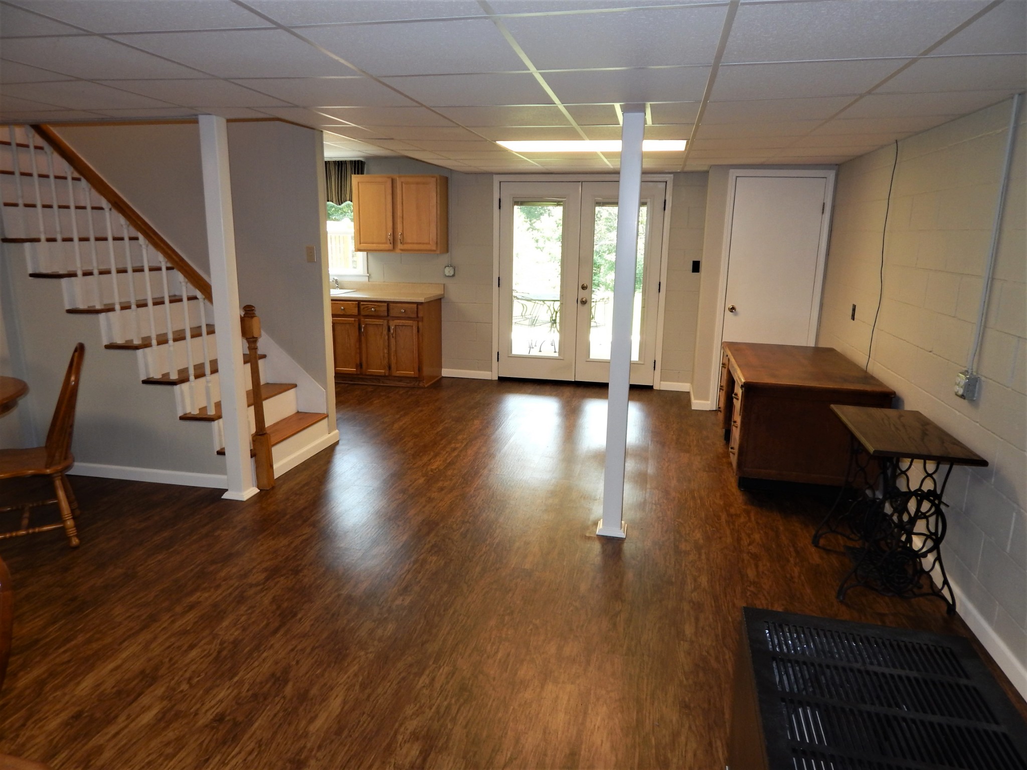 3753 Chisholm Road Iron City, TN 38463 - Photo 27 of 50 a view of an empty room with wooden floor and stairs