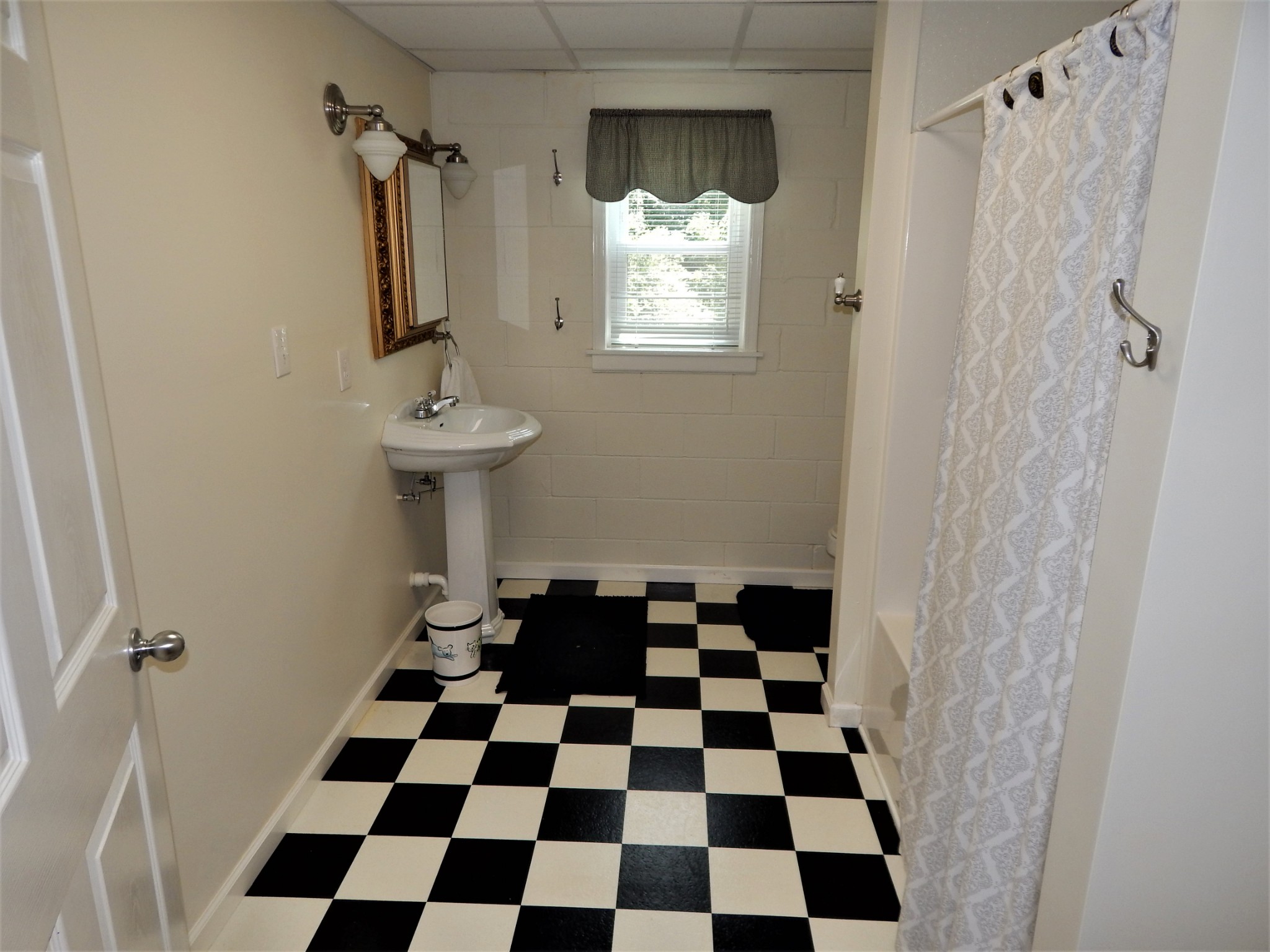 3753 Chisholm Road Iron City, TN 38463 - Photo 32 of 50 a black and white checkered floor
