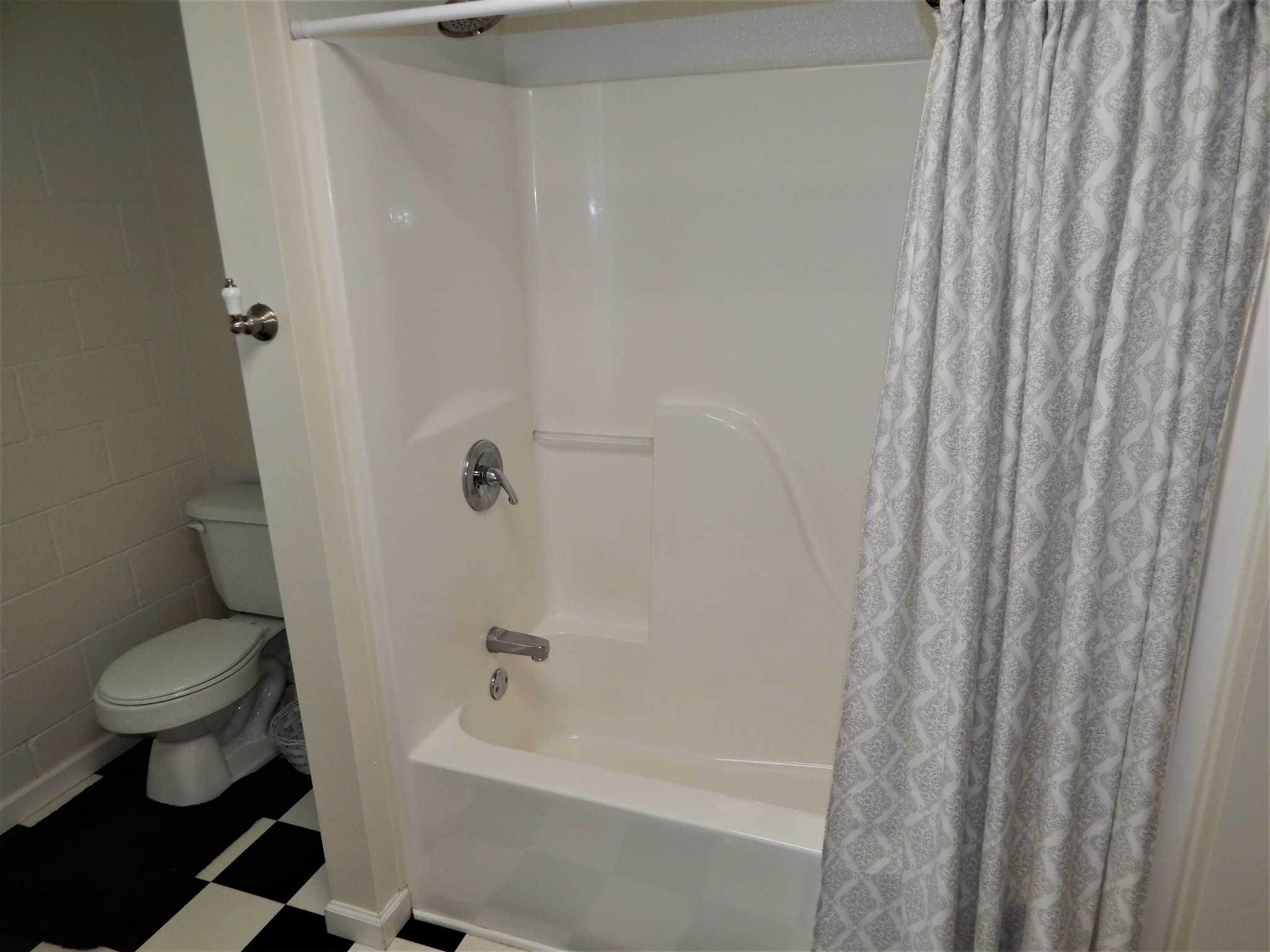 3753 Chisholm Road Iron City, TN 38463 - Photo 33 of 50 a bathroom with a bathtub and a toilet