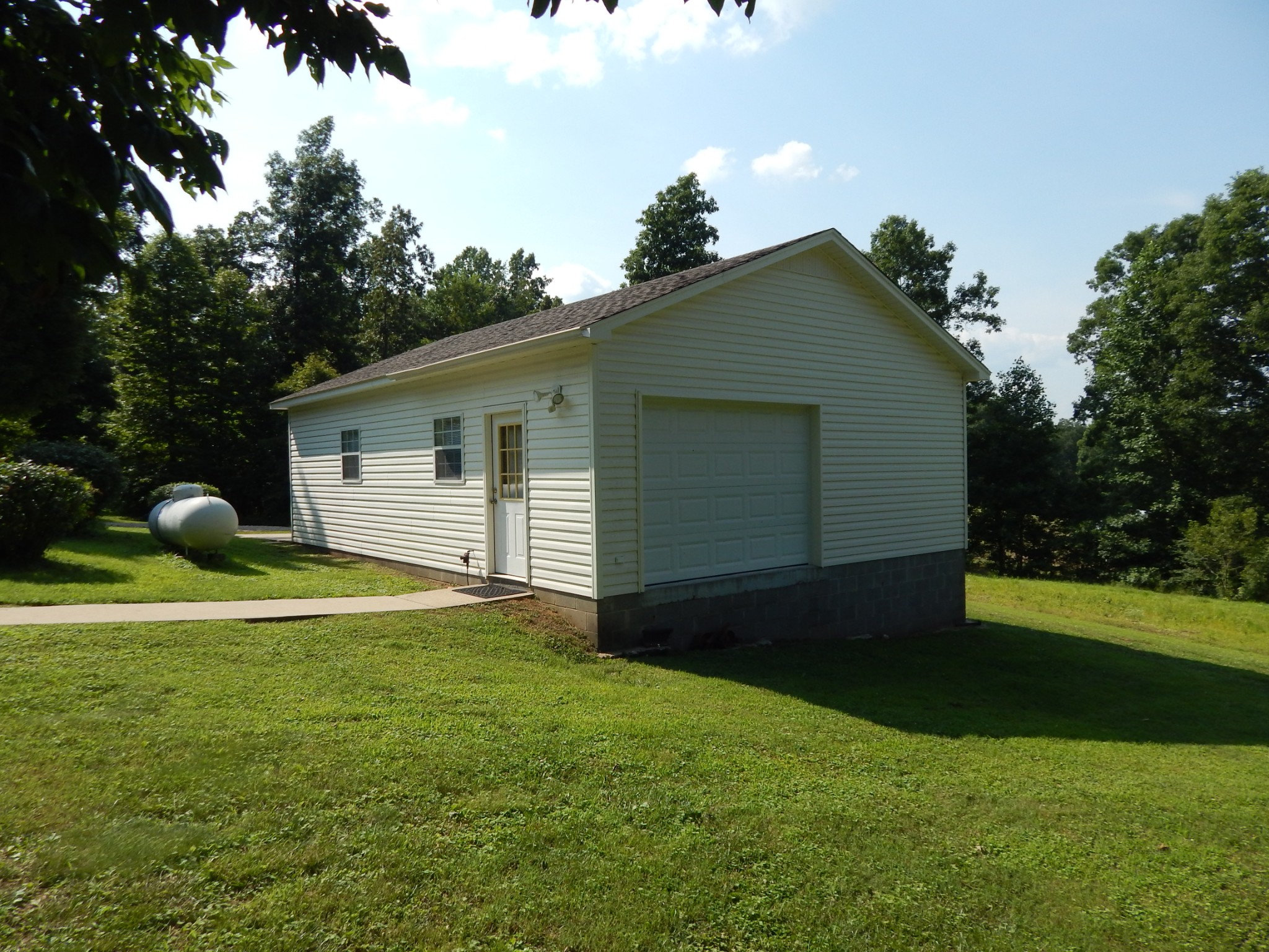 3753 Chisholm Road Iron City, TN 38463 - Photo 37 of 50 a backyard of a house with lots of green space