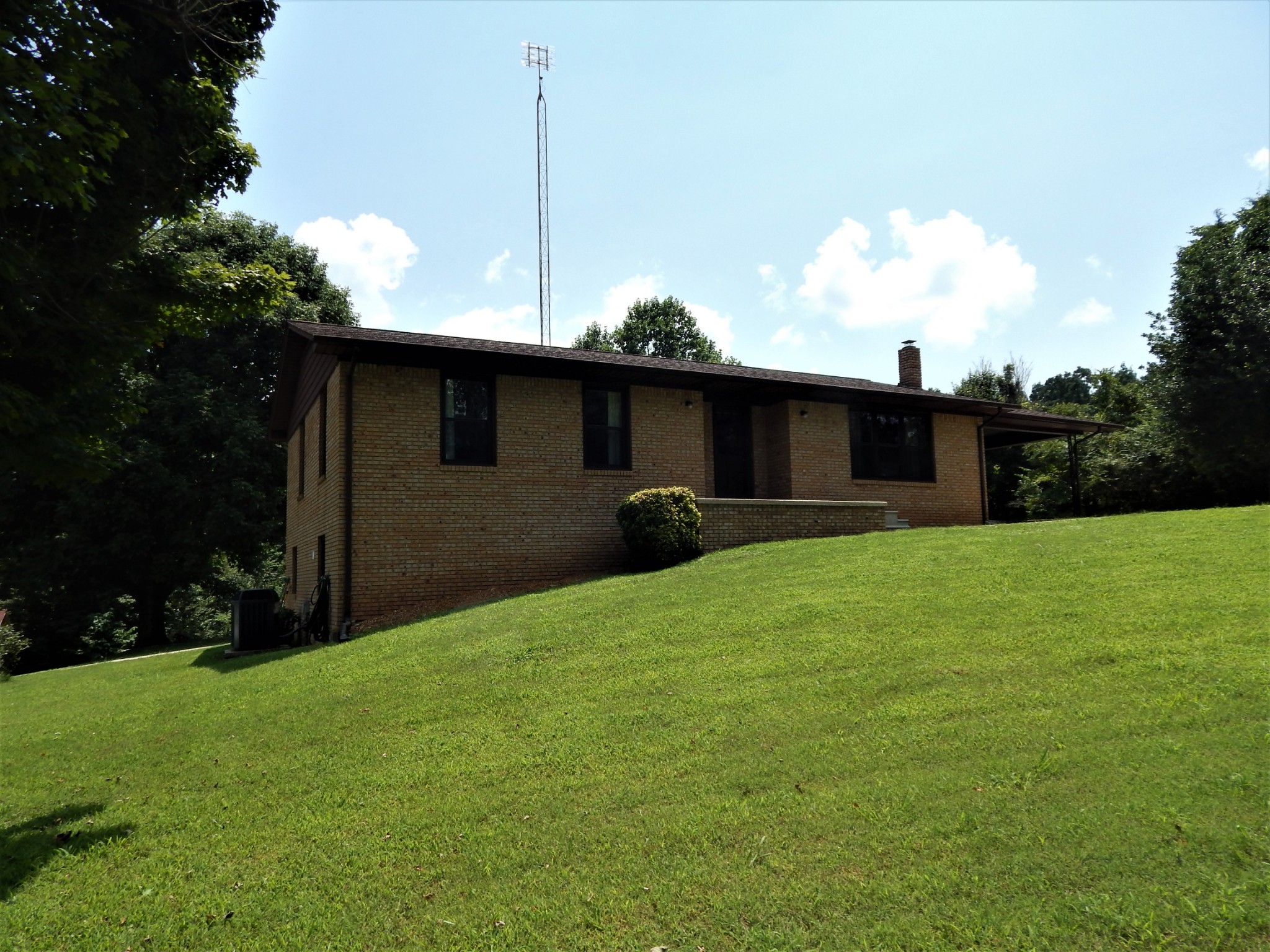 3753 Chisholm Road Iron City, TN 38463 - Photo 5 of 50 a front view of a house with garden