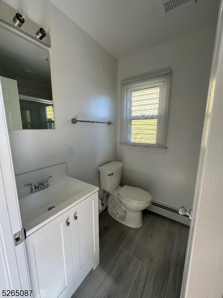 16 Colfax Street, Unit 4 Raritan, NJ 08869 - Photo 12 of 15 a bathroom with a sink and a toilet