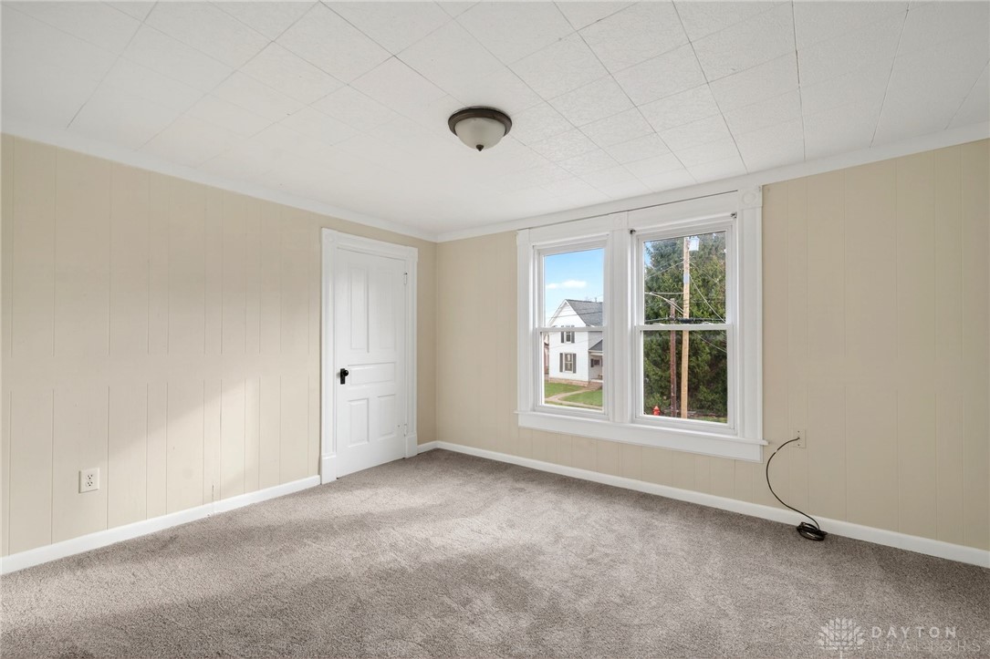 585 North Spring Street Wilmington, OH 45177 - Photo 16 of 21 Bright and airy, this room offers a blank canvas for personalization.