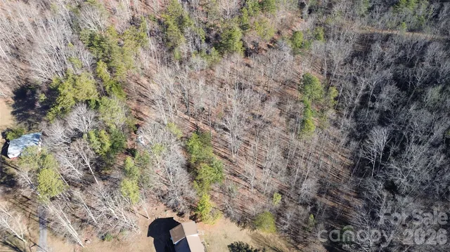 a view of a house with a mountain in the background