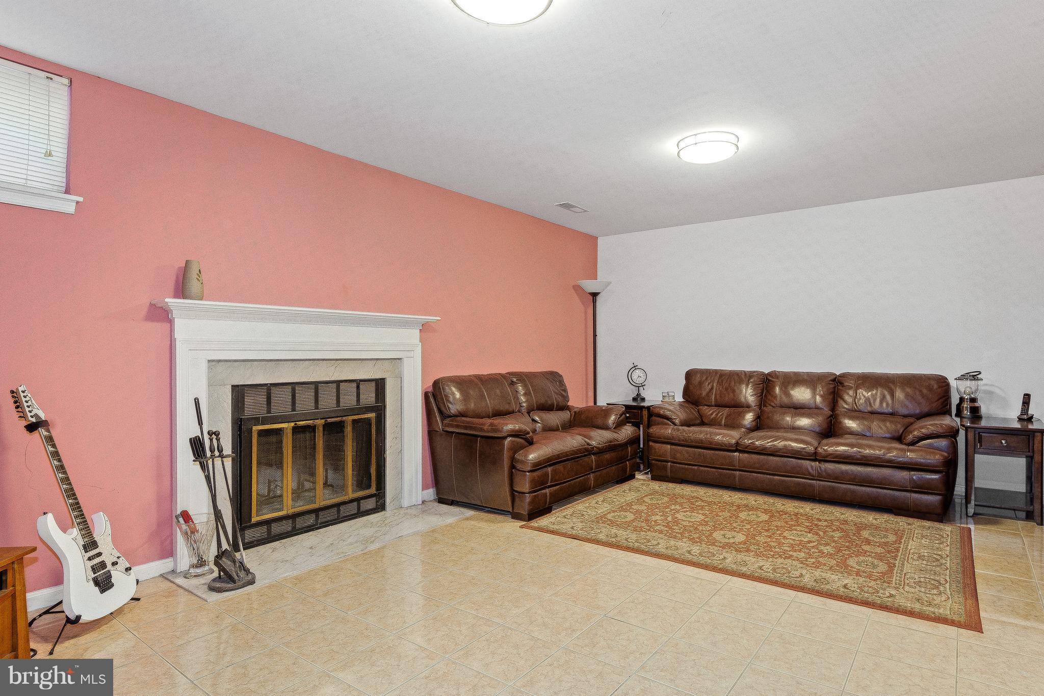 15113 Callohan Court Silver Spring, MD 20906 - Photo 23 of 30 RECREATION ROOM W/WOODBURNING FIREPLACE