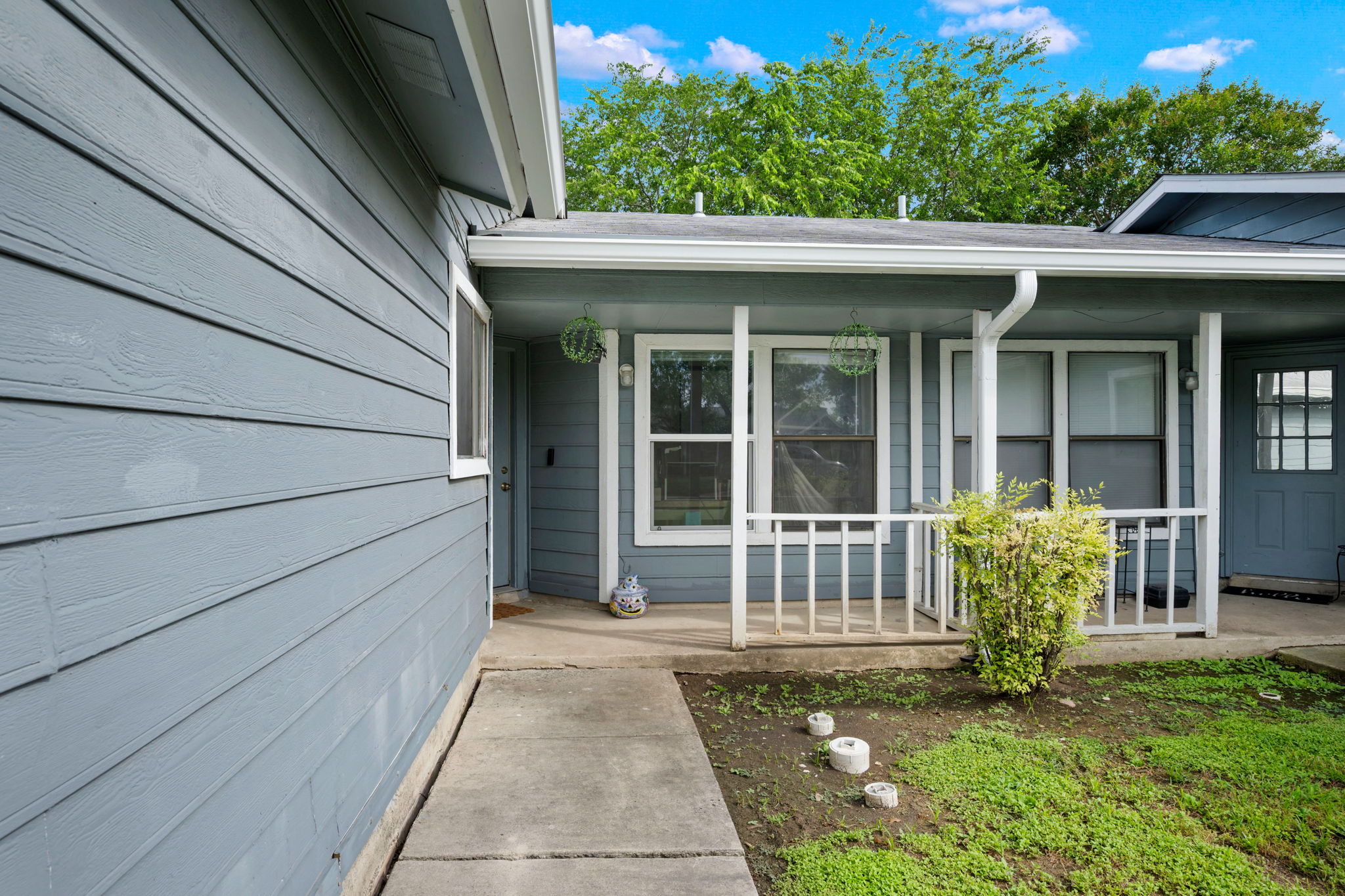 8317 Forest Ridge Drive San Antonio, TX 78239 - Photo 2 of 26 A welcoming covered porch with a sturdy railing offers a charming entry to this residence.