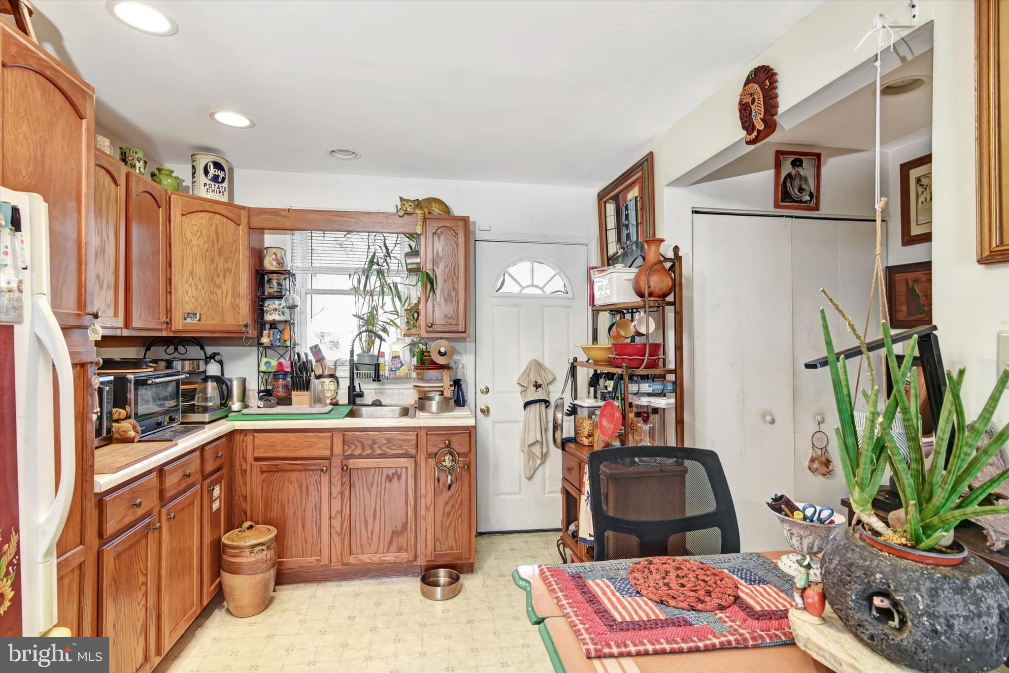 110 Natrona Avenue Hamilton, NJ 08619 - Photo 11 of 21 a kitchen with a sink appliances and cabinets