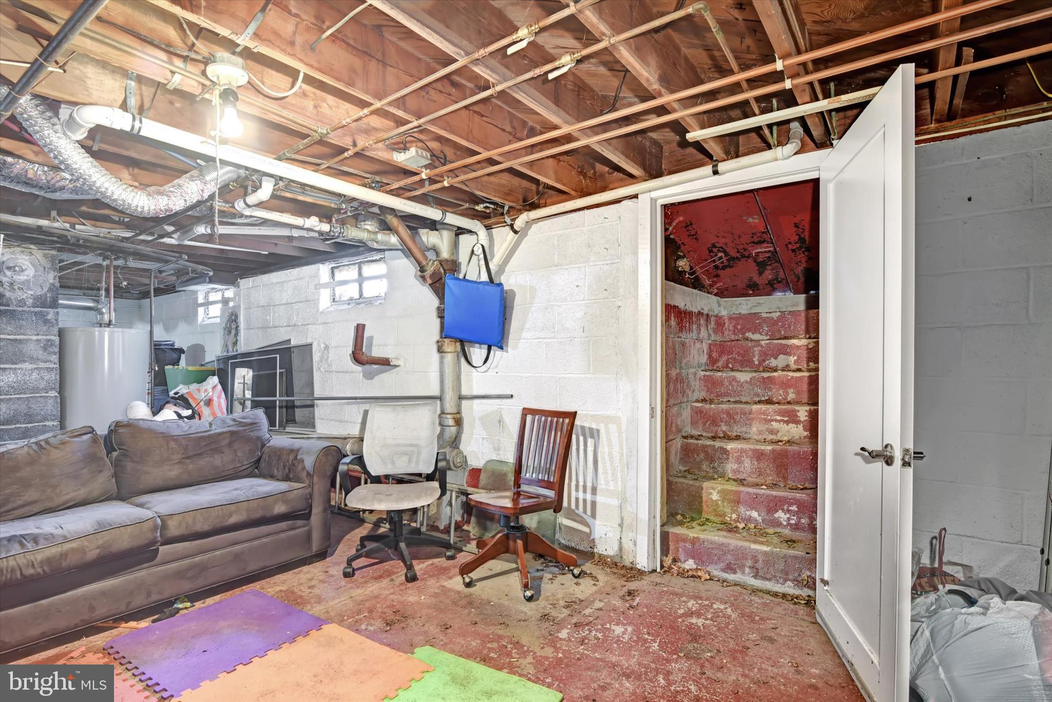110 Natrona Avenue Hamilton, NJ 08619 - Photo 13 of 21 a living room with furniture and a chandelier