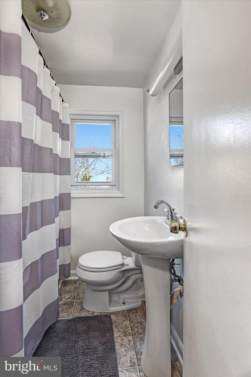 110 Natrona Avenue Hamilton, NJ 08619 - Photo 7 of 21 a bathroom with a sink toilet and shower