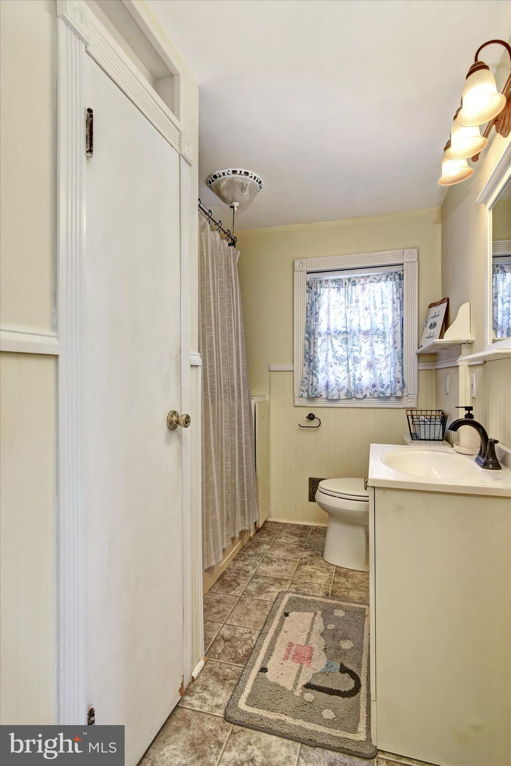 110 Natrona Avenue Hamilton, NJ 08619 - Photo 8 of 21 a living room with a toilet and a window