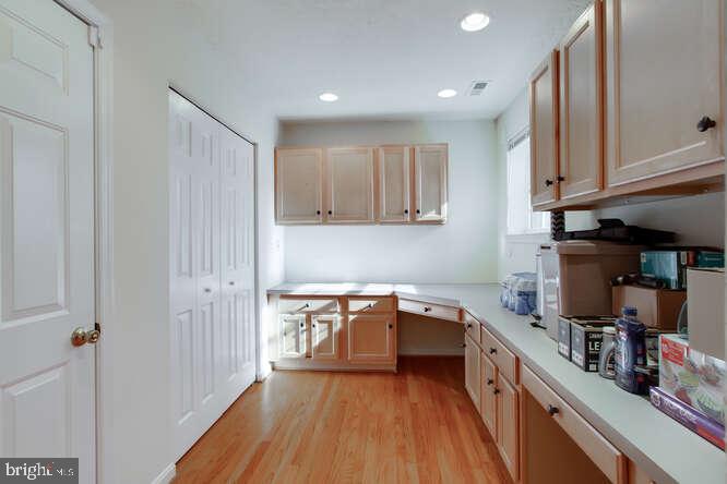 8610 Turkey Hill Road White Plains, MD 20695 - Photo 11 of 47 a kitchen with a sink and wooden floor
