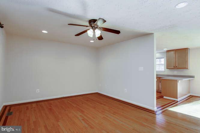 8610 Turkey Hill Road White Plains, MD 20695 - Photo 12 of 47 a view of an empty room with window and wooden floor