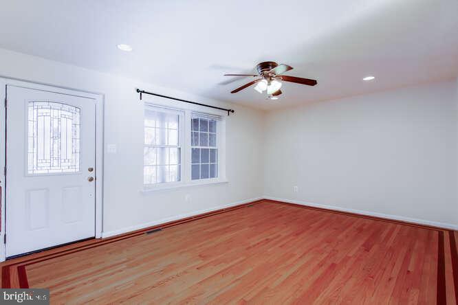 8610 Turkey Hill Road White Plains, MD 20695 - Photo 15 of 47 a view of a room with wooden floor and ceiling fan
