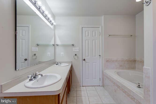 8610 Turkey Hill Road White Plains, MD 20695 - Photo 21 of 47 a bathroom with a bathtub and a sink