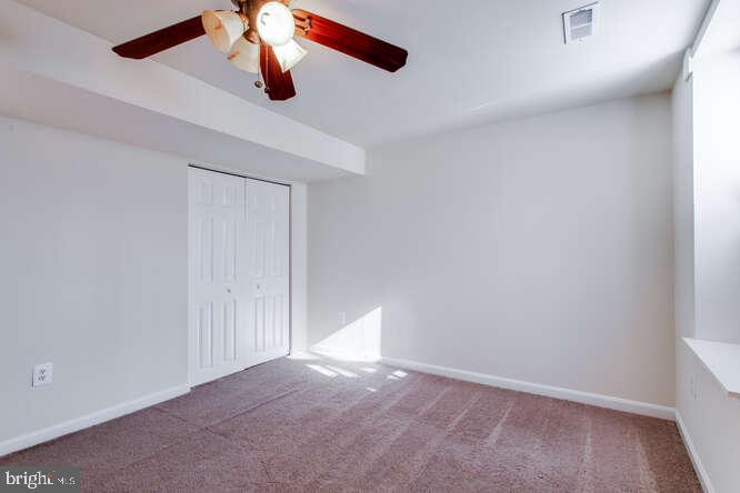 8610 Turkey Hill Road White Plains, MD 20695 - Photo 30 of 47 an empty room with ceiling fan and window