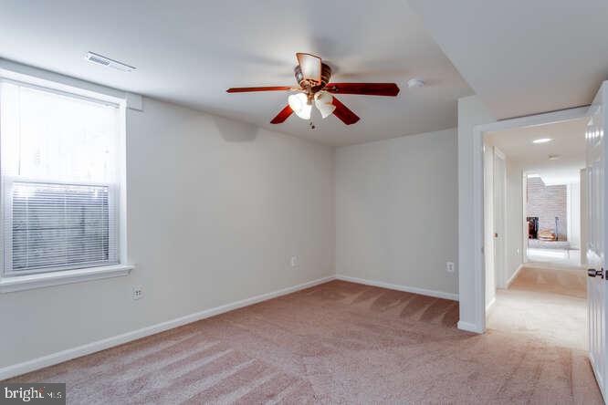 8610 Turkey Hill Road White Plains, MD 20695 - Photo 32 of 47 a view of a livingroom with a ceiling fan and window