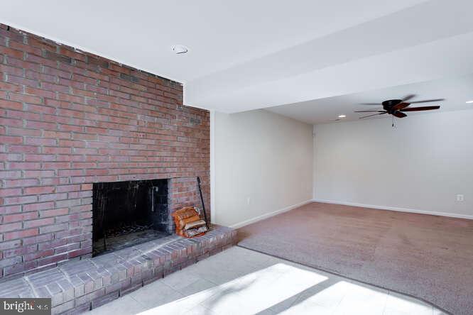 8610 Turkey Hill Road White Plains, MD 20695 - Photo 40 of 47 a living room with furniture and a fireplace