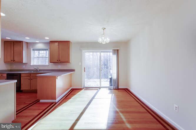 8610 Turkey Hill Road White Plains, MD 20695 - Photo 4 of 47 a large kitchen with stainless steel appliances granite countertop a stove a sink and a refrigerator