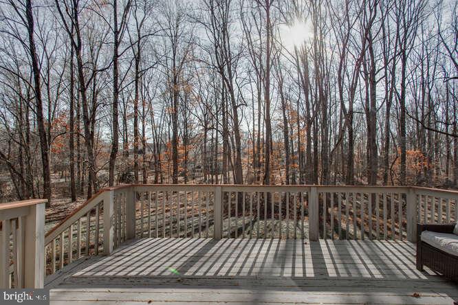 8610 Turkey Hill Road White Plains, MD 20695 - Photo 42 of 47 a view of a balcony with wooden floor and fence