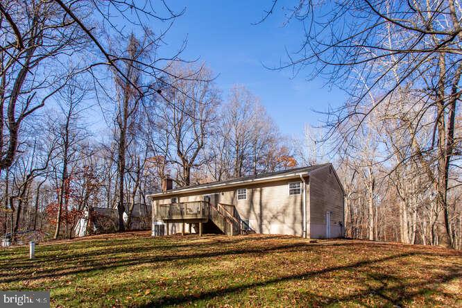 8610 Turkey Hill Road White Plains, MD 20695 - Photo 44 of 47 a front view of a house with a yard