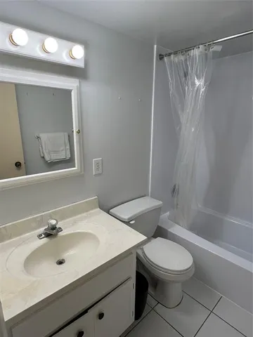 a view of empty room with windows