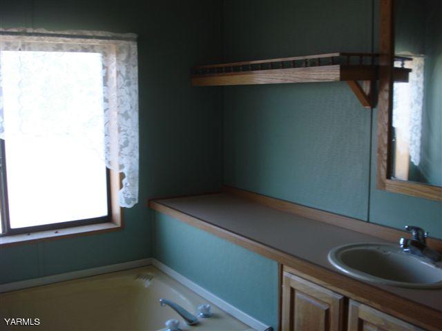 100 Martin Road Toppenish, WA 98948 - Photo 12 of 14 a room with a window and a sink