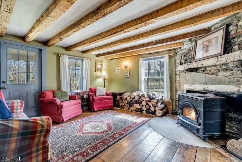 25 Clove Road Wantage, NJ 07461 - Photo 15 of 49 a bedroom with furniture fireplace and window