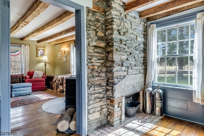 25 Clove Road Wantage, NJ 07461 - Photo 16 of 49 a living room with furniture and a fireplace