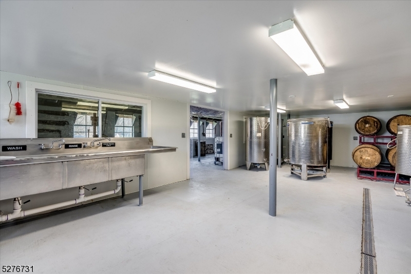 25 Clove Road Wantage, NJ 07461 - Photo 32 of 49 a room with gym equipment and a large window