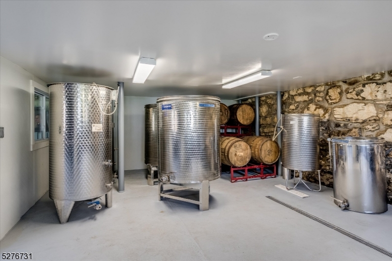 25 Clove Road Wantage, NJ 07461 - Photo 33 of 49 a room with gym equipment and large mirror