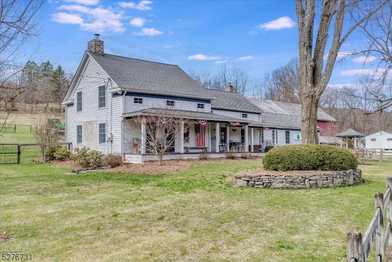 25 Clove Road Wantage, NJ 07461 - Photo 6 of 49 a front view of a house with swimming pool having outdoor seating
