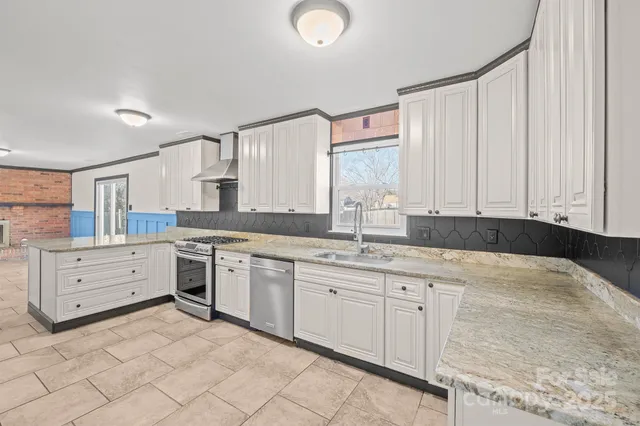 a spacious bathroom with a double vanity sink and a mirror