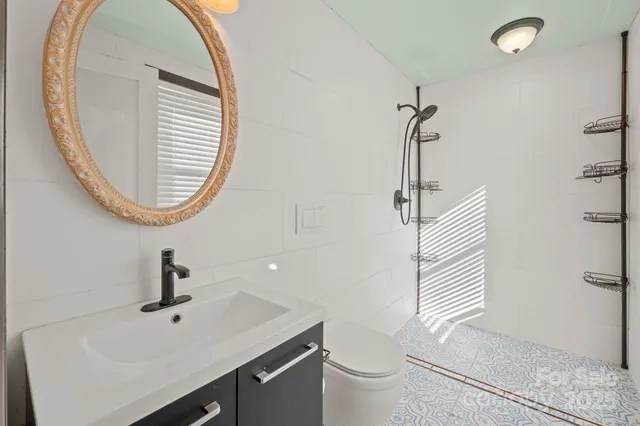 a view of a room with stairs and windows