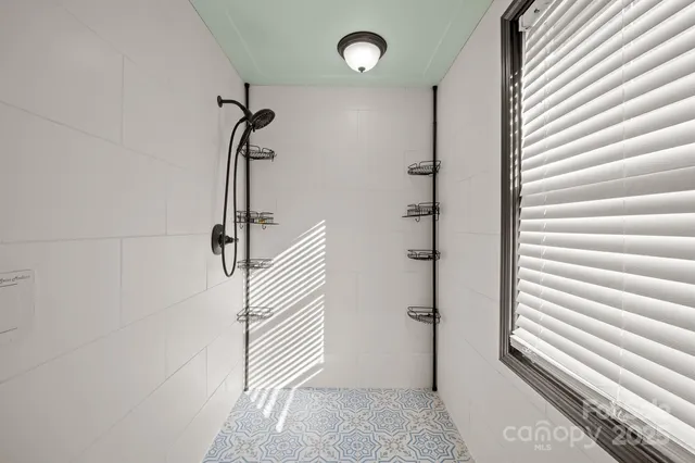 a front view of a house with a yard outdoor seating and garage