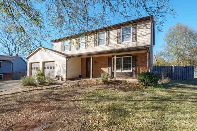 a aerial view of a house with a yard