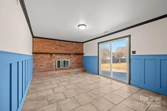 a view of an empty room and glass door