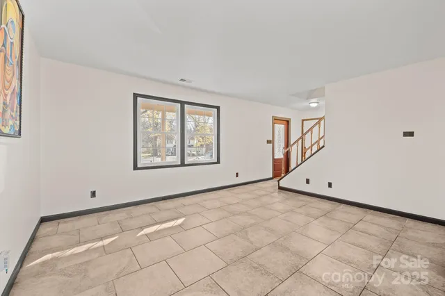 a view of kitchen with cabinets