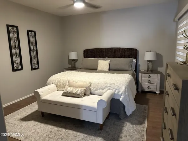 a bedroom with a bed and a couch