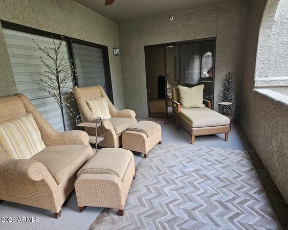 a hotel room with two beds and large windows