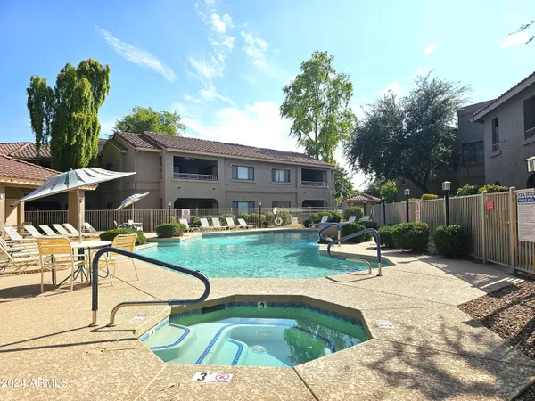 a view of a swimming pool with a patio