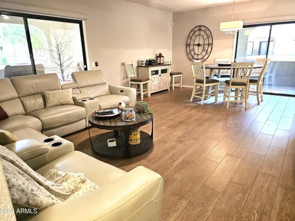 a living room with furniture and a large window