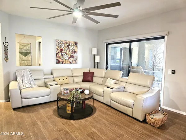 a living room with furniture and a large window
