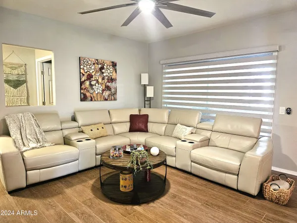 a living room with furniture and a large window